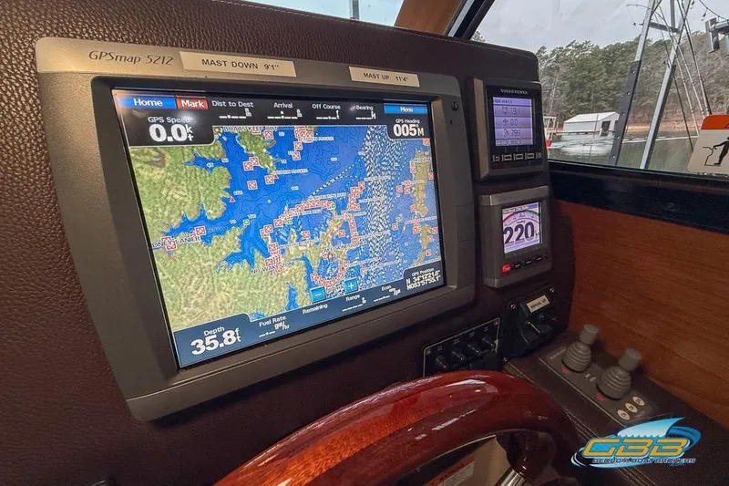 Slide: The Image of GPS navigation system on a 2013 Cutwater C-28 boat dashboard, displaying a detailed map. - 47