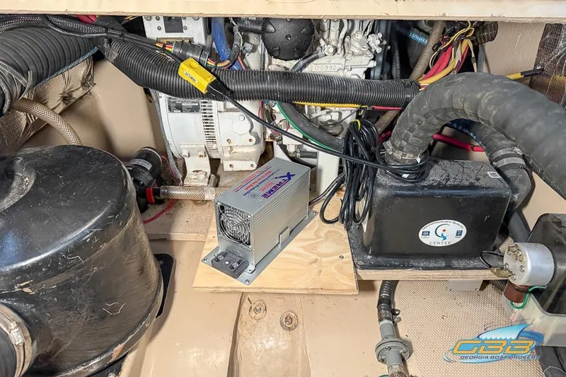 Slide: The Image of Engine compartment of a 2013 Cutwater C-28 boat, featuring various mechanical components. - 75