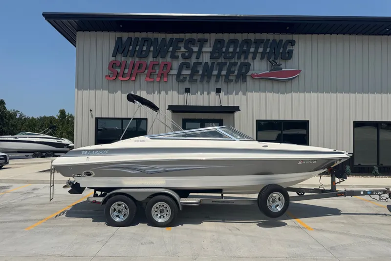 The Image of 2008 Larson LXi 228 boat on trailer at Midwest Boating Super Center. - 1