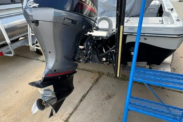 Slide: The Image of Outboard motor of 2015 BLUEWAVE 2200 PURE boat on trailer, side view. - 9