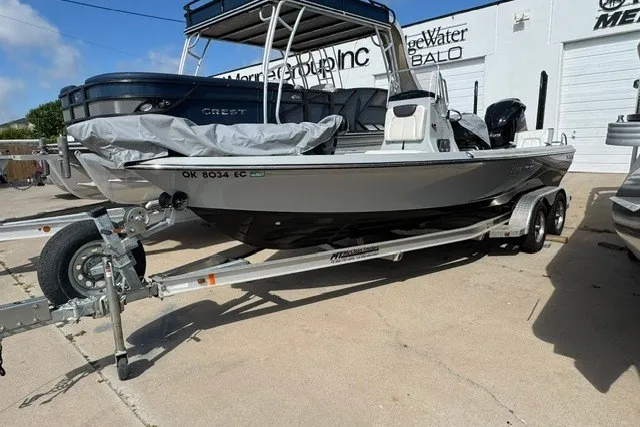 Slide: The Image of 2015 BLUEWAVE 2200 PURE boat on trailer, parked outdoors. - 12