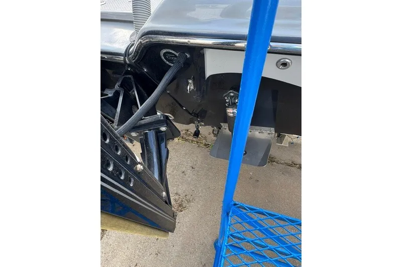 Slide: The Image of 2015 BLUEWAVE 2200 PURE boat transom with hydraulic components and blue metal railing. - 6