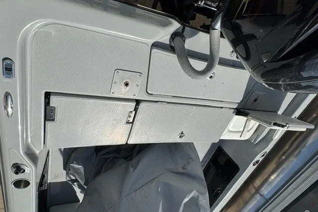 Slide: The Image of Interior view of a 2015 BLUEWAVE 2200 PURE boat showing storage compartments. - 7