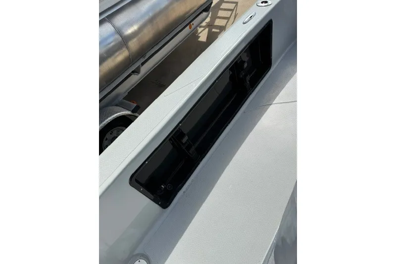 Slide: The Image of 2015 BLUEWAVE 2200 PURE boat interior storage compartment, open and empty. - 17