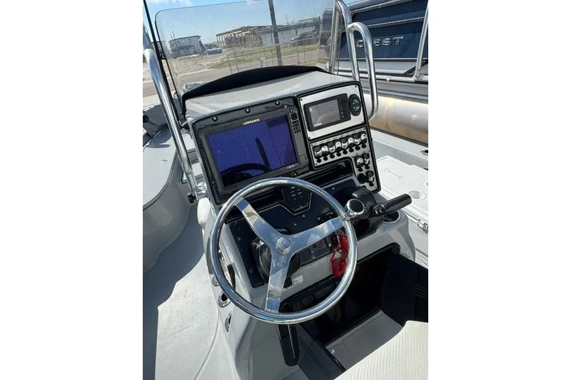 Slide: The Image of Steering console of 2015 BLUEWAVE 2200 PURE boat with navigation equipment. - 8