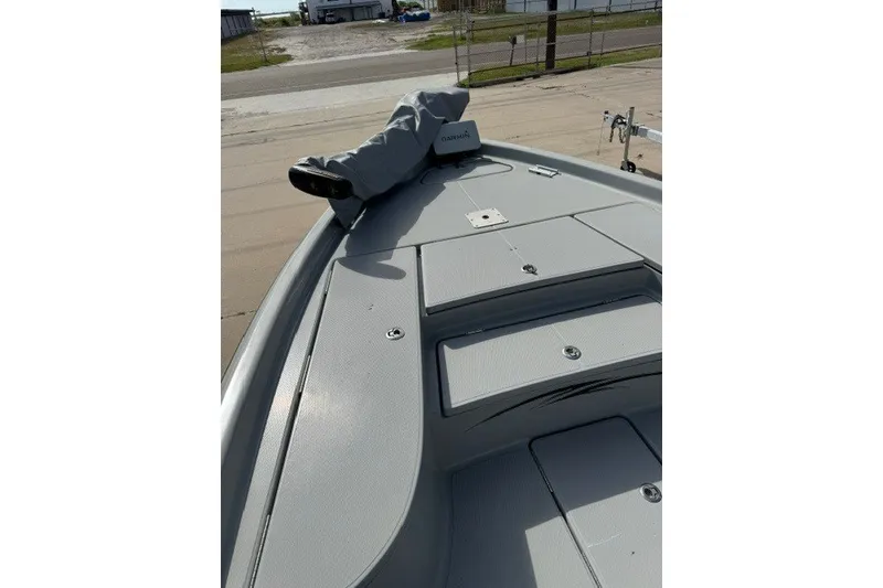 Slide: The Image of 2015 BLUEWAVE 2200 PURE boat deck with Garmin equipment, docked on a sunny day. - 20