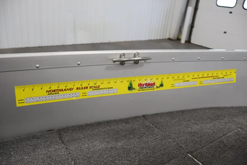 Slide: The Image of 2004 Alumacraft Navigator 165 CS boat with Northland ruler scale for fish measurement. - 21