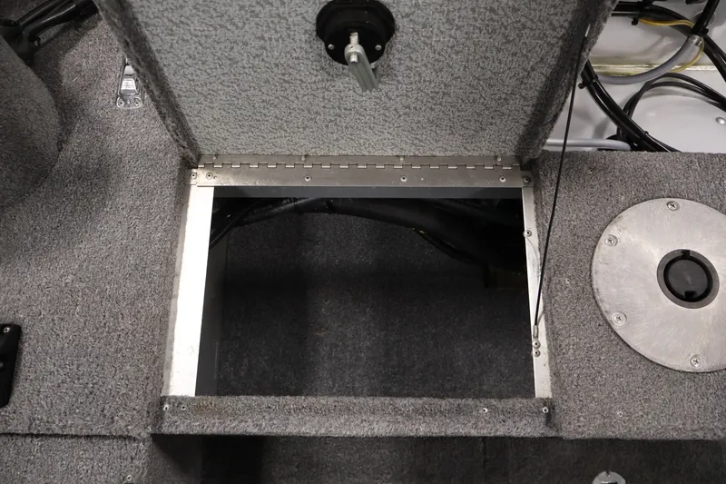 Slide: The Image of Open storage compartment in 2004 Alumacraft Navigator 165 CS boat interior. - 34