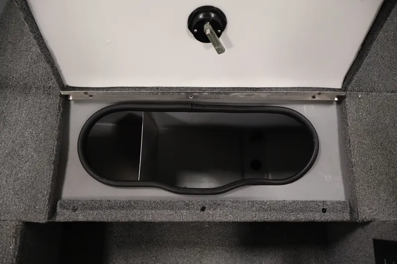 Slide: The Image of Storage compartment in 2004 Alumacraft Navigator 165 CS boat, featuring carpeted interior. - 20