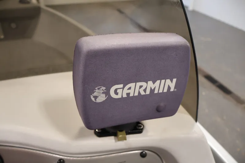 Slide: The Image of Garmin device on 2004 Alumacraft Navigator 165 CS boat dashboard. - 27