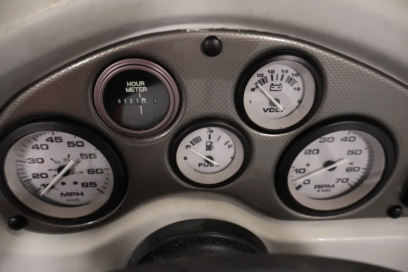 Slide: The Image of Dashboard gauges of a 2004 Alumacraft Navigator 165 CS boat. - 25