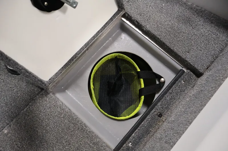 Slide: The Image of 2004 Alumacraft Navigator 165 CS boat storage compartment with mesh bag. - 19