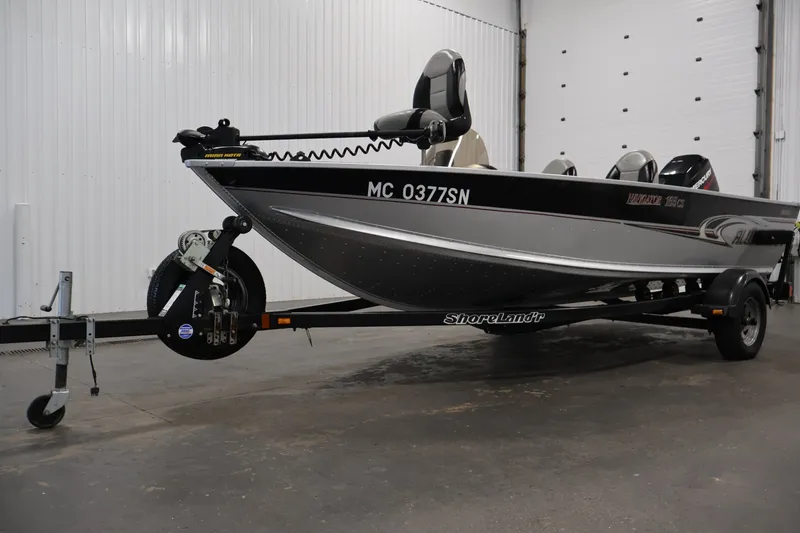 Slide: The Image of 2004 Alumacraft Navigator 165 CS boat on ShoreLand'r trailer in indoor storage. - 44