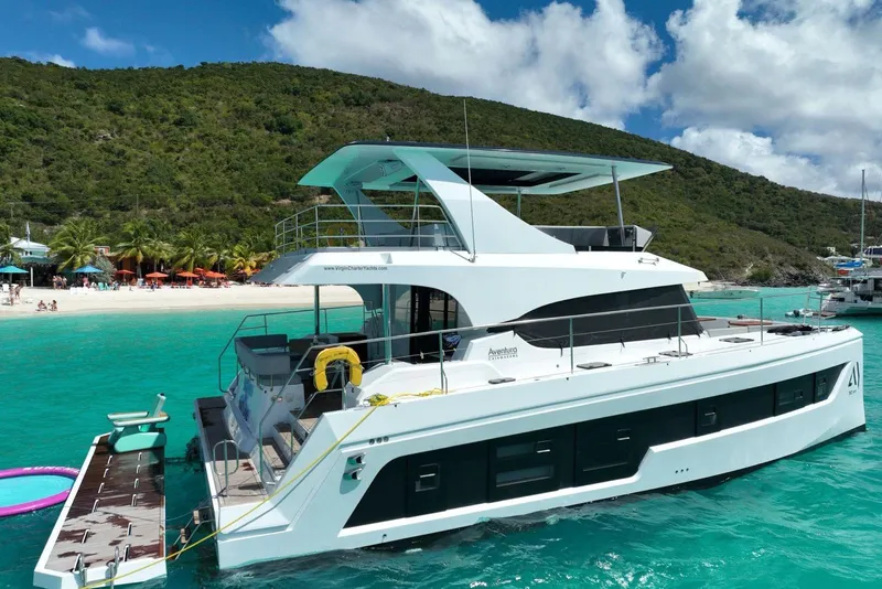 The Image of Aventura 56 Motor Yacht 2026 anchored near a tropical beach with clear turquoise water. - 21