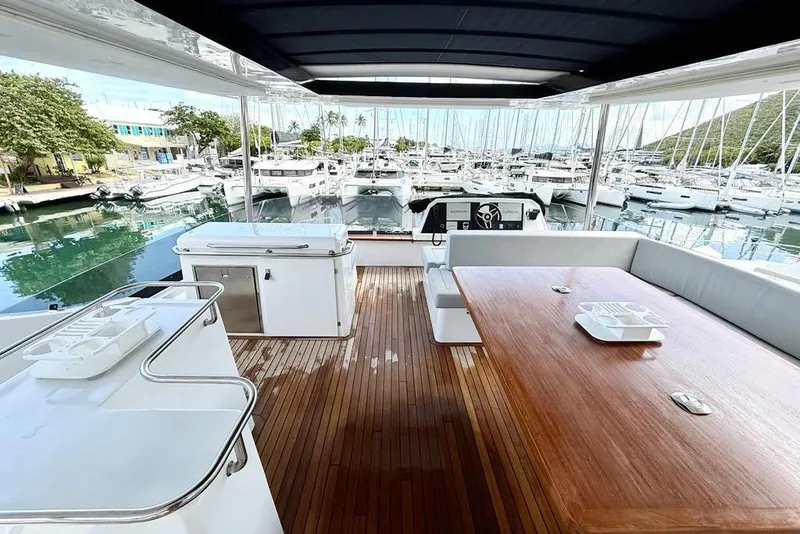 Slide: The Image of Luxurious 2026 Aventura 56 Motor Yacht with spacious deck and marina view. - 24