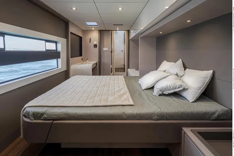 Slide: The Image of Luxurious bedroom interior of 2026 Aventura 56 Motor Yacht with ocean view window. - 16