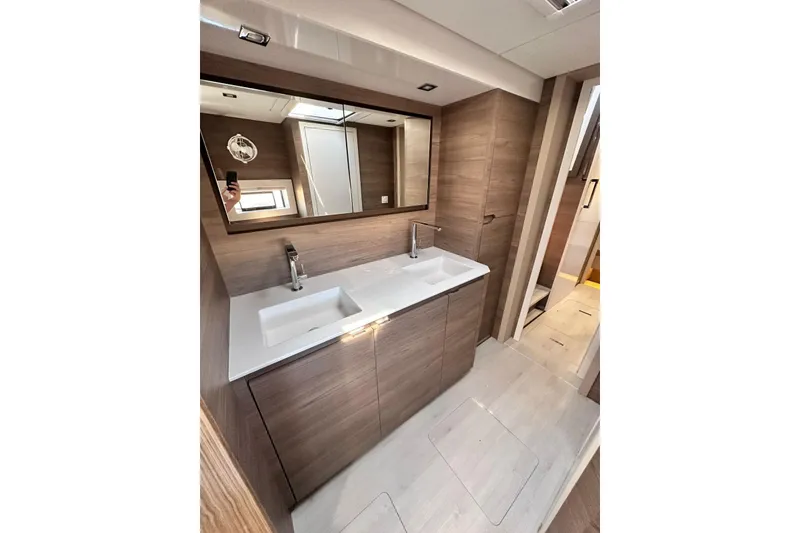 Slide: The Image of Luxurious bathroom in 2026 Aventura 56 Motor Yacht with dual sinks and modern design. - 18