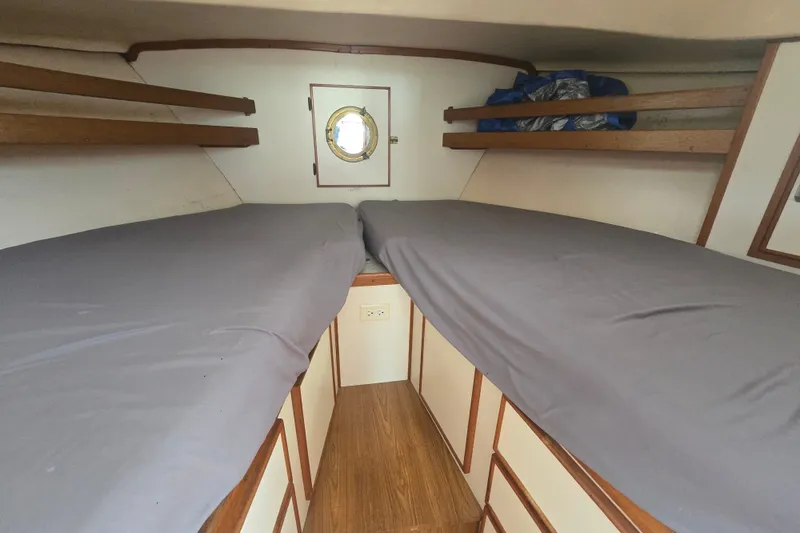 Slide: The Image of Interior cabin of 1983 Atlantic 30 LRC boat with twin beds and porthole. - 17