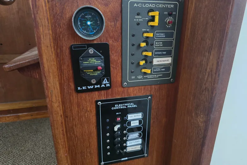 Slide: The Image of Electrical control panels on 1983 Atlantic 30 LRC boat, featuring switches and gauges. - 27