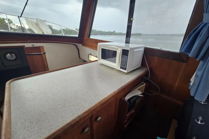 Slide: The Image of Interior of 1983 Atlantic 30 LRC boat with microwave on counter. - 15