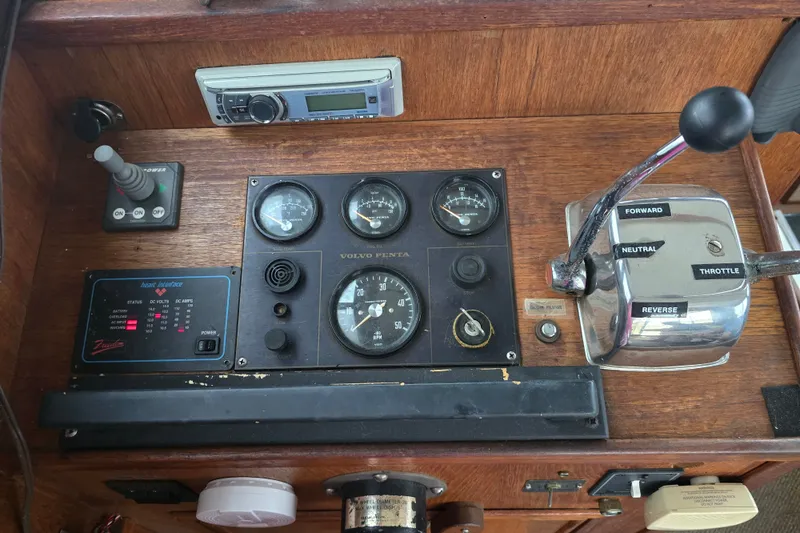 Slide: The Image of Control panel of a 1983 Atlantic 30 LRC boat with gauges and throttle. - 21