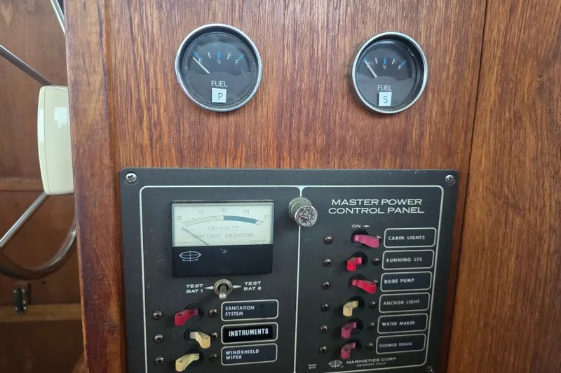 Slide: The Image of Control panel of 1983 Atlantic 30 LRC boat with fuel gauges and switches. - 26