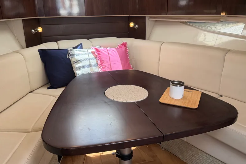 Slide: The Image of Luxurious interior of 2015 Sea Ray 370 Venture yacht with cozy seating and elegant table. - 40