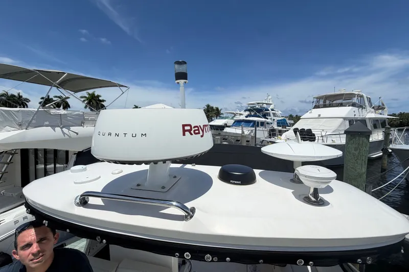 Slide: The Image of 2015 Sea Ray 370 Venture yacht with radar equipment docked at marina. - 26