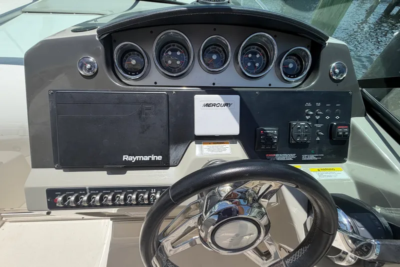 Slide: The Image of Control panel of 2015 Sea Ray 370 Venture boat with Raymarine and Mercury systems. - 36