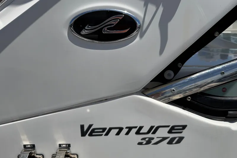 Slide: The Image of 2015 Sea Ray 370 Venture boat logo and model name on hull. - 13