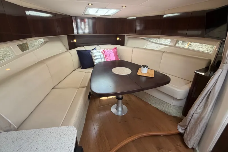 Slide: The Image of Luxurious interior of 2015 Sea Ray 370 Venture yacht with elegant seating and dining area. - 46