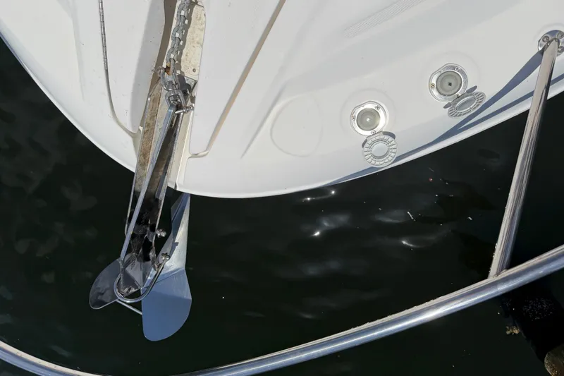 Slide: The Image of 2015 Sea Ray 370 Venture boat anchor and bow details on water. - 29