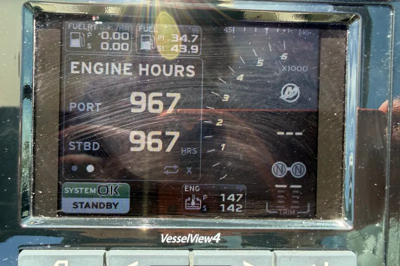 Slide: The Image of Display screen of 2015 Sea Ray 370 Venture showing engine hours and system status. - 34