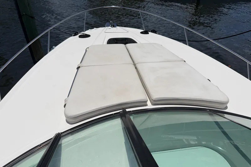 Slide: The Image of 2015 Sea Ray 370 Venture boat with cushioned sunbathing area on deck. - 27