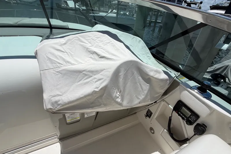 Slide: The Image of Covered helm of 2015 Sea Ray 370 Venture boat at dock. - 37