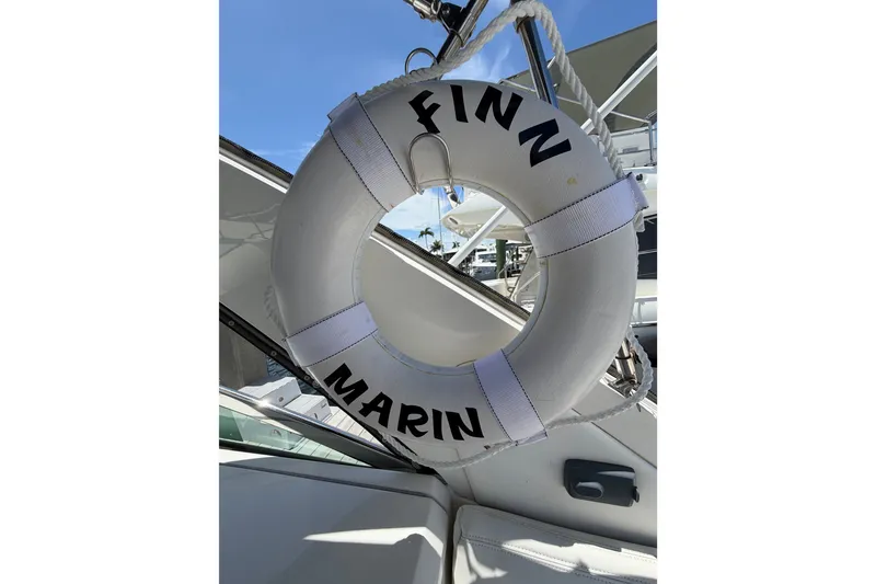 Slide: The Image of Life ring on 2015 Sea Ray 370 Venture boat, labeled "Finn Marin." - 53
