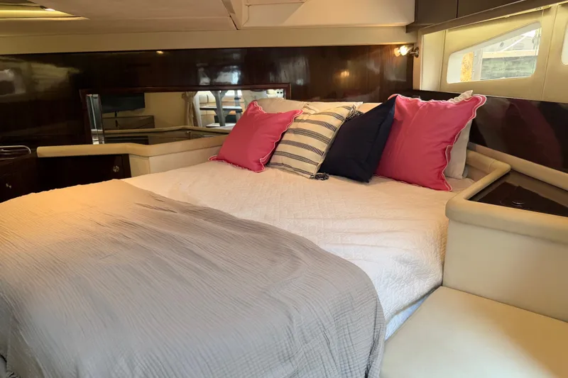 Slide: The Image of Luxurious cabin interior of 2015 Sea Ray 370 Venture with plush bedding and stylish decor. - 48