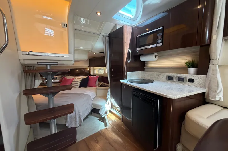 Slide: The Image of Interior of 2015 Sea Ray 370 Venture yacht with modern kitchen and cozy sleeping area. - 52