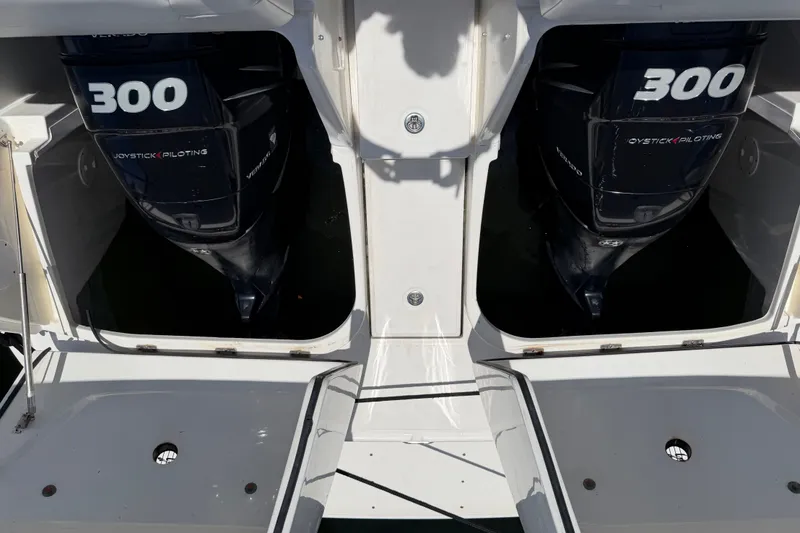 Slide: The Image of Twin 300 horsepower engines on a 2015 Sea Ray 370 Venture boat. - 19