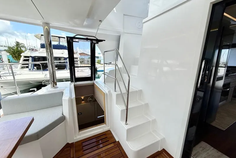 Slide: The Image of Interior view of 2026 Aventura 56 Motor Yacht, featuring stairs and modern design elements. - 14
