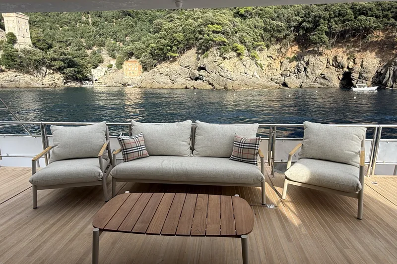 Slide: The Image of Luxury seating area on 2026 Aventura 56 Motor Yacht with scenic coastal view. - 11