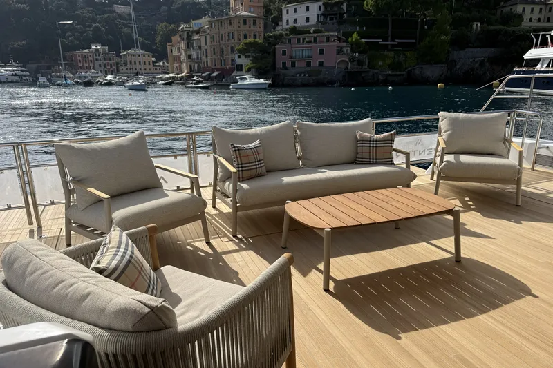 Slide: The Image of Luxurious deck seating on 2026 Aventura 56 Motor Yacht, overlooking scenic waterfront. - 9