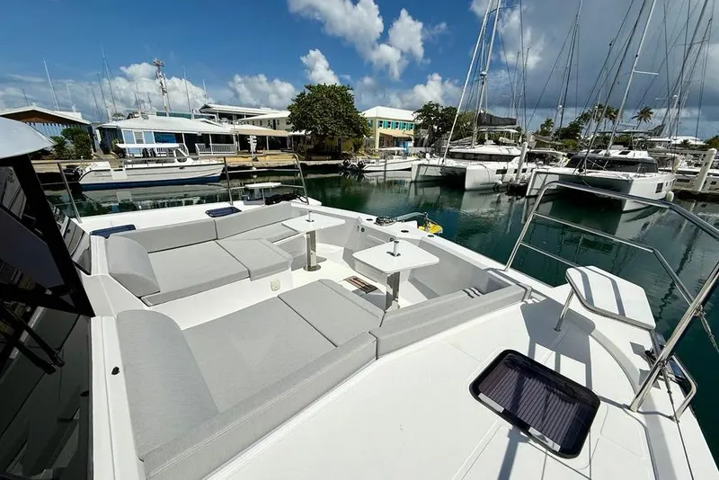 Slide: The Image of Aventura 56 Motor Yacht 2026 with spacious deck seating in a marina setting. - 20