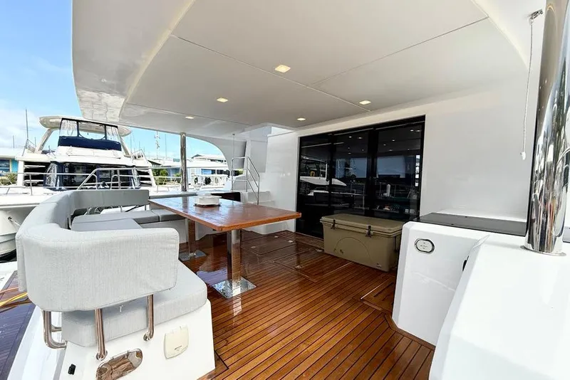 Slide: The Image of Luxurious 2026 Aventura 56 Motor Yacht with spacious deck and elegant seating area. - 22