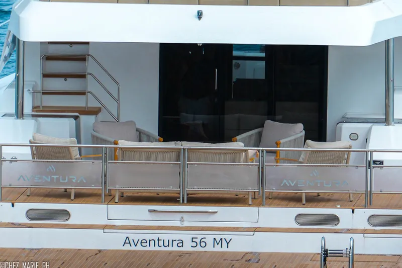 Slide: The Image of Aventura 56 Motor Yacht 2026, featuring elegant outdoor seating on the deck. - 6