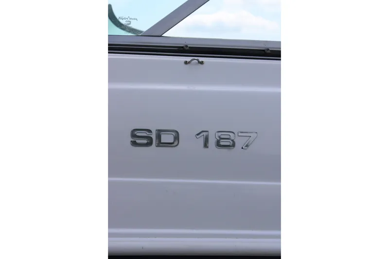 Slide: The Image of 2020 Hurricane SunDeck 187 OB boat emblem on white surface. - 16