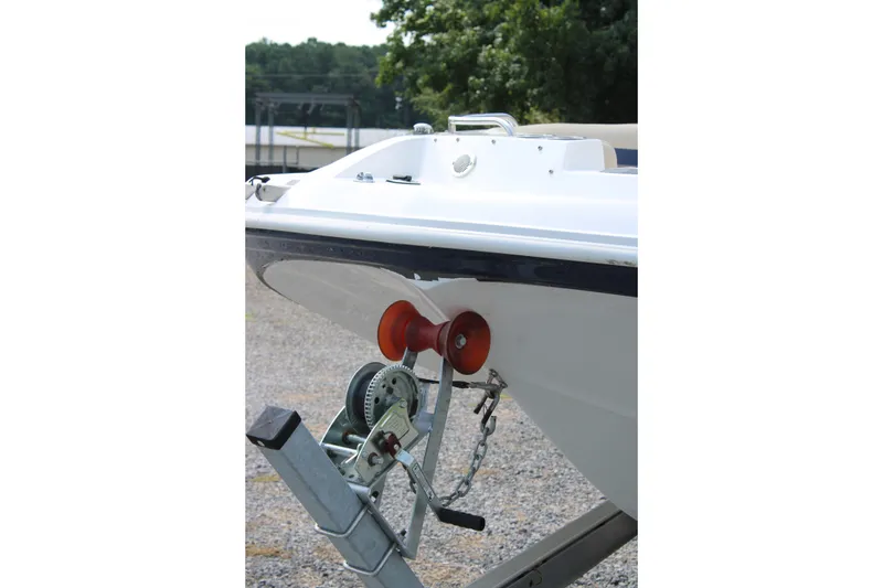 Slide: The Image of 2020 Hurricane SunDeck 187 OB boat on trailer, close-up of bow and winch system. - 15