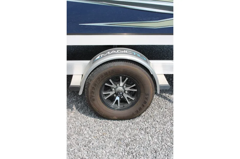 Slide: The Image of Trailer wheel of 2020 Hurricane SunDeck 187 OB on gravel surface. - 13