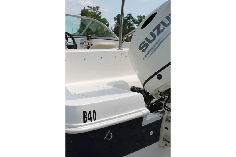 Slide: The Image of 2020 Hurricane SunDeck 187 OB boat with Suzuki outboard motor, side view. - 19