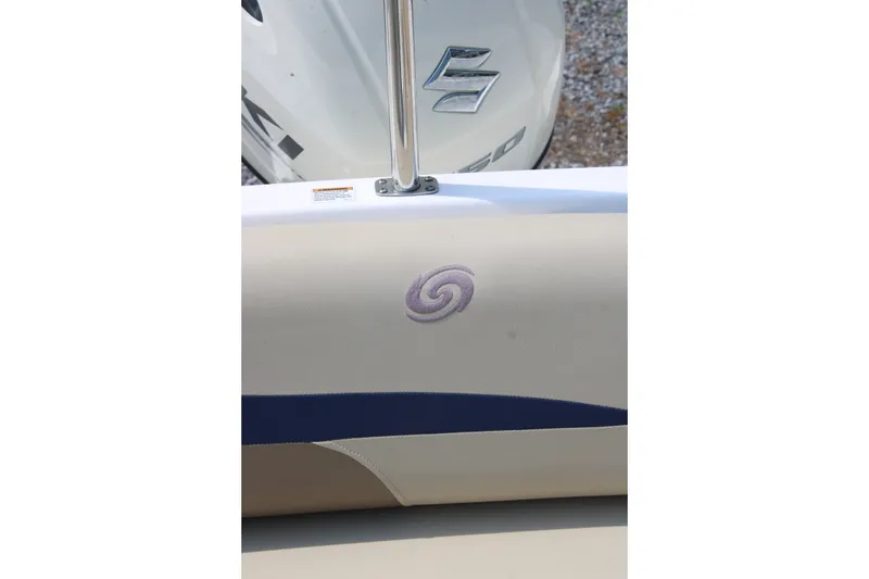 Slide: The Image of 2020 Hurricane SunDeck 187 OB boat interior with logo and Suzuki engine. - 28